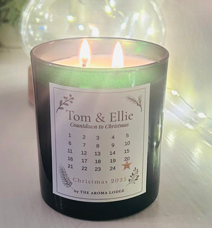Candle with a label featuring 'Tom & Ellie' and a Christmas countdown calendar.
