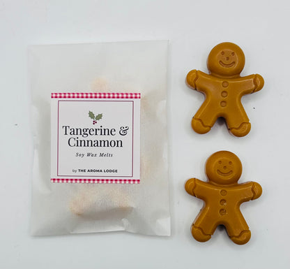 Tangerine & Cinnamon soy wax melts packaging with gingerbread man-shaped melts on a white background