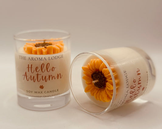 Soy wax candle with sunflower decoration from The Aroma Lodge on a neutral background