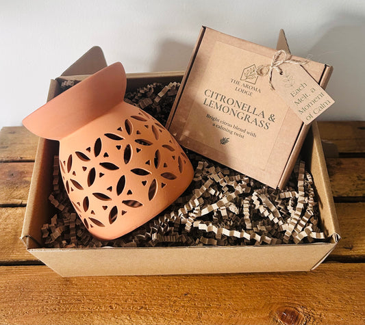 Decorative lantern and box with product information on a wooden surface